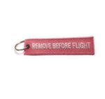 LLAVEROS BORDADOS REMOVE BEFORE FLIGH ROSADO - Imagen 2