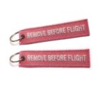 LLAVEROS BORDADOS REMOVE BEFORE FLIGH ROSADO - Imagen 4