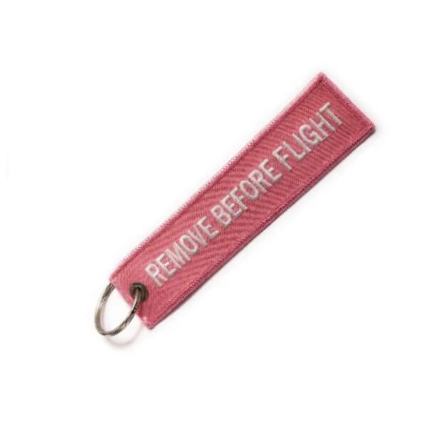 LLAVEROS BORDADOS REMOVE BEFORE FLIGH ROSADO